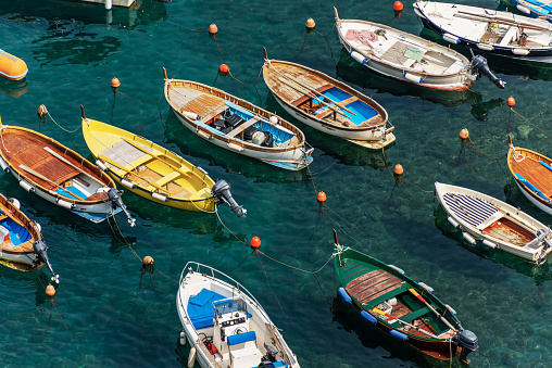 Elevated view of a group of small boats moored in the port of the ancient Vernazza village, Cinque Terre National Park, UNESCO world heritage site, Mediterranean Sea, La Spezia province, Liguria, Italy, South Europe. This famous nature park includes the villages of Riomaggiore, Manarola, Corniglia, Vernazza and Monterosso al Mare.