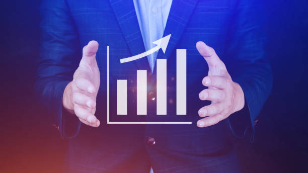 istock Businessman showing business growth on graph Hands touching graphs representing increasing profits with virtual interface technology, financial symbols coming 1461567943