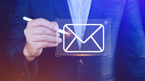 istock Businessman holding checking email online with virtual interface technology. Direct marketing, online message, E-mail, electronic mail, communication concept. 1461567944