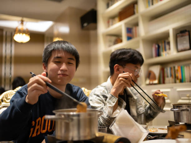 istock Asian man eating a small hot pot 1461569066