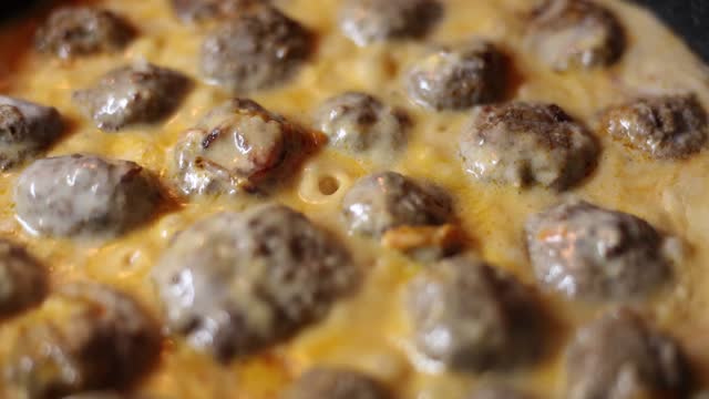 Cook meatballs from natural meat and spices in frying pan