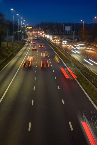 istock Fast moving traffic on the M42 passes through an active traffic management system during rush hour. 1461569569