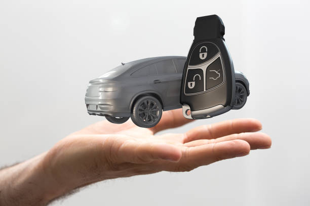 istock 3D rendered car and keys over a male hand isolated on white background 1461569987