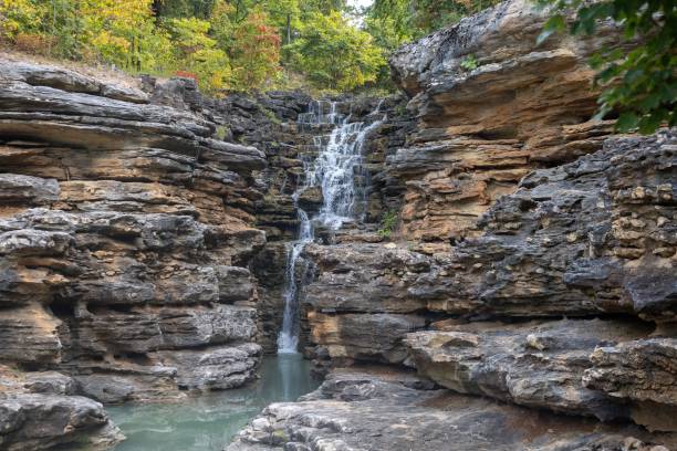 istock Beautiful shot of a waterfall stream over the cliff 1461571360