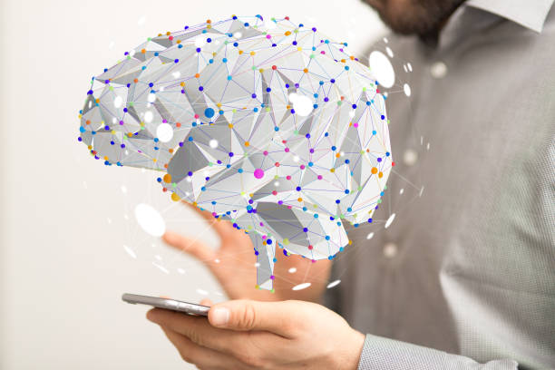 istock 3D rendered brain hovering over the person's hand holding a smartphone 1461571642