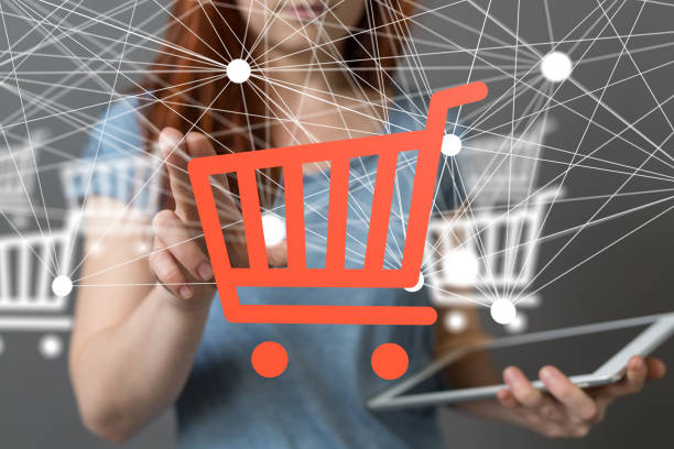 istock Female's hand reaching to 3D rendered shopping carts 1461572376