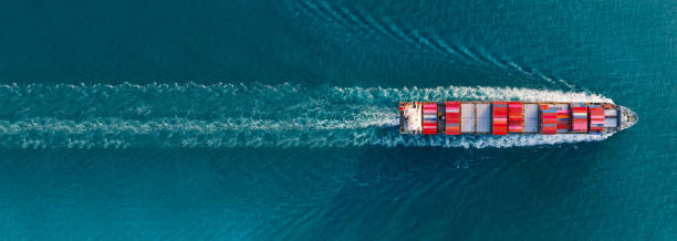 istock banner,Top view of cargo container ship carrying container and running for export goods from cargo yard port to custom ocean concept technology transportation , customs clearance. forwarder 1461573397