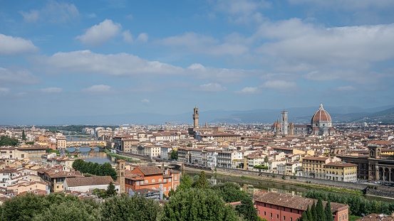 12th June. 2022 - View of the Duomo Santa Maria del Fiore in Florence, Italy, from a viewpoint overlooking the city showing market stalls and tourists taking in the magnificent vista.