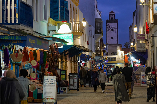 Morocco. Essaouira. People walking in the street of the medina at night