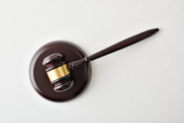 istock Judge gavel background on white table top view 1461578789