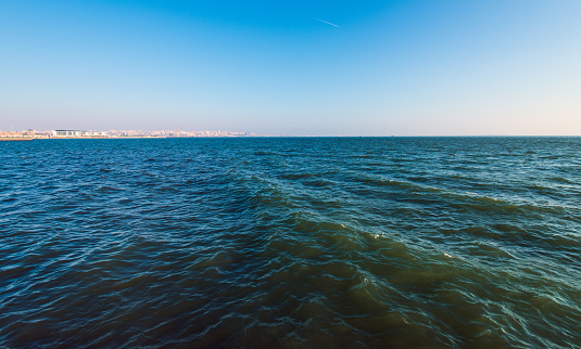 A beautiful view of the sea under a clear blue sky on a sunny day
