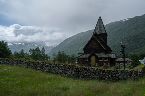 A beautiful shot of the historic Roldal Stave church near the mountains in Norway