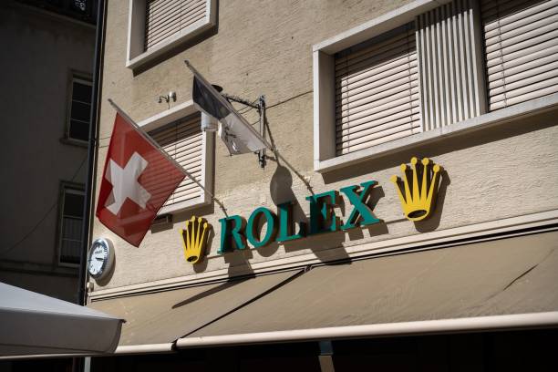 closeup of 'rolex' on a wall on a sunny day in chur, grisons, switzerland - chur imagens e fotografias de stock