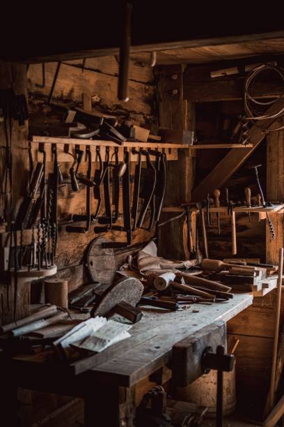 istock Vertical shot of old tools of carpenter workshop on wooden table 1461582552