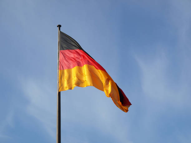 istock Waving flag of Germany under the blue sky 1461582634