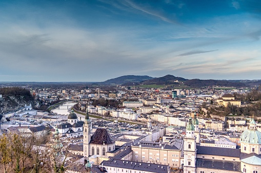 An aerial view of cityscape Salzburg surrounded by buildings