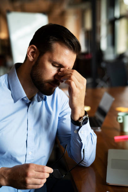 istock Man sitting in the office working on laptop. 1461583584