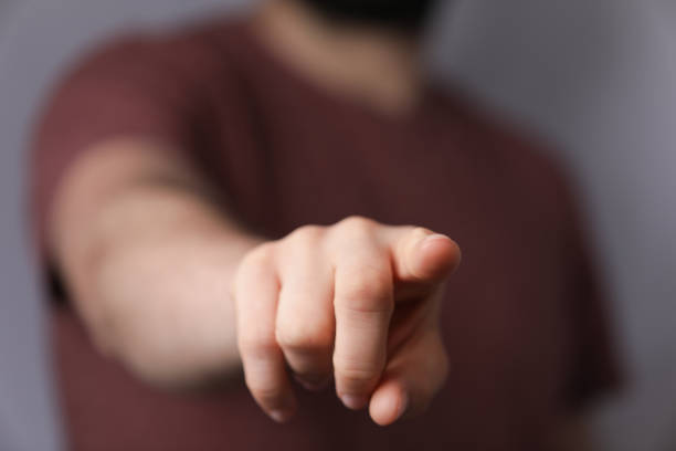 istock Selective focus shot of a male pointing with a finger 1461583904