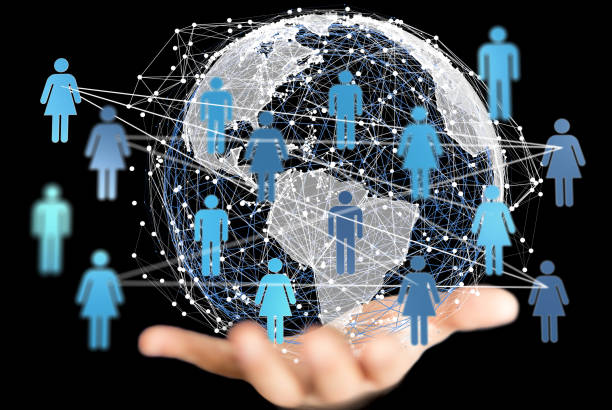 istock 3D rendered futuristic globe with people silhouettes held in a person's hand 1461584935