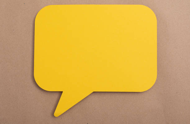 istock Yellow communication paper speak bubble on the table 1461585288
