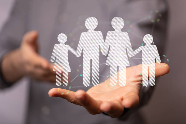 istock 3d rendered family members hovering over a man's hand 1461585613