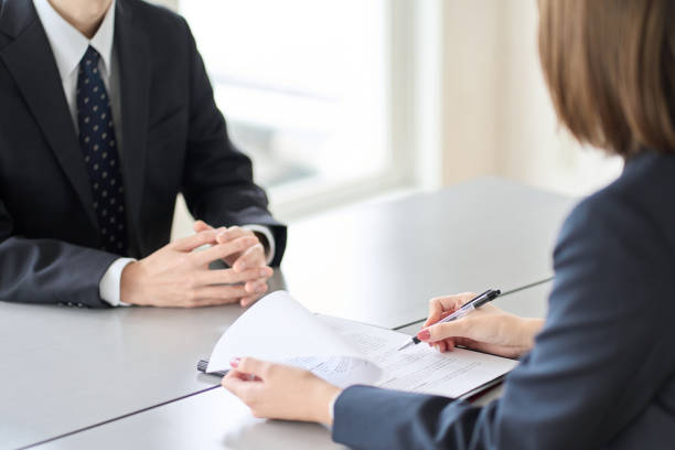 Hands of a woman conducting a business interview Hands of a woman conducting a business interview obscured face stock pictures, royalty-free photos & images