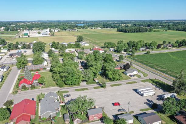 Aerial view of a town with green fields