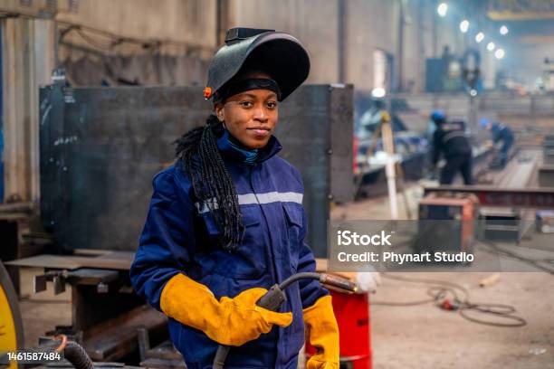 Young Woman Welding Stock Photo - Download Image Now - Welder, Working, Construction Industry