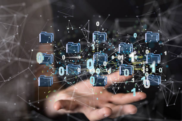 istock Closeup of the hand holding virtual folders with binary numbers. Artificial Intelligence. 1461589134