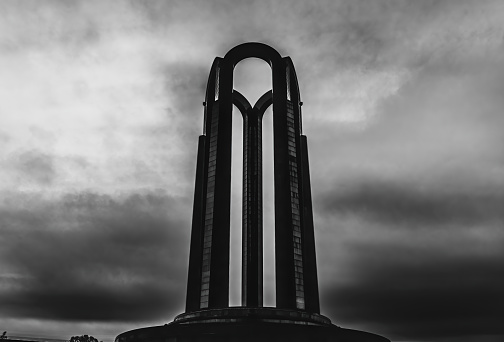 An exterior view of a Nation's Heroes Memorial on cloudy sky background in Bucharest, Romania