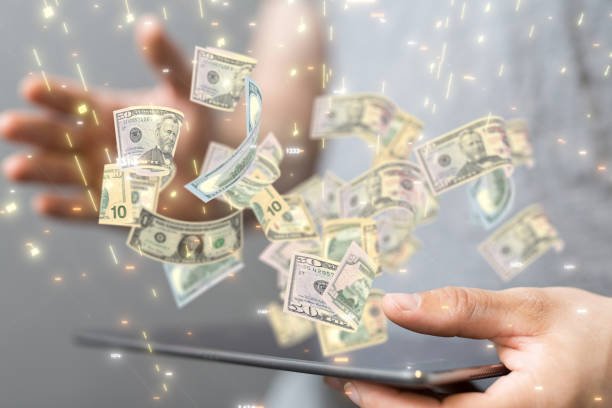 istock 3D render of falling banknotes with a human from the background 1461589978