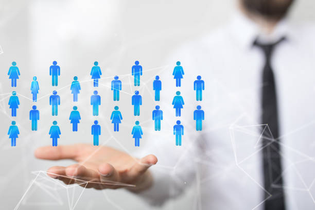 istock Closeup of the hand holding the digital human figures. 1461589984