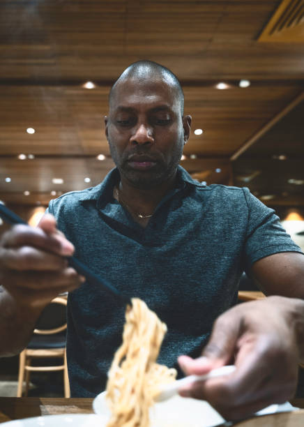 istock A man eating Jajangmyeon with chopsticks 1461590656