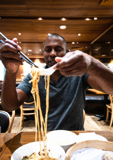 istock A man eating Jajangmyeon with chopsticks 1461590657