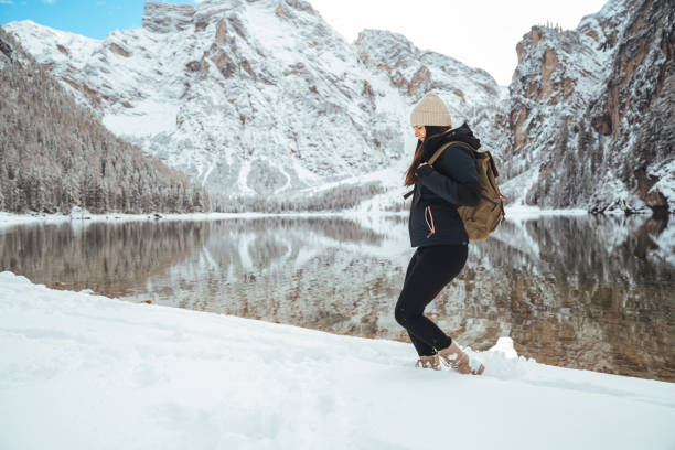 istock Beautiful young woman in winter park having fun 1461590886