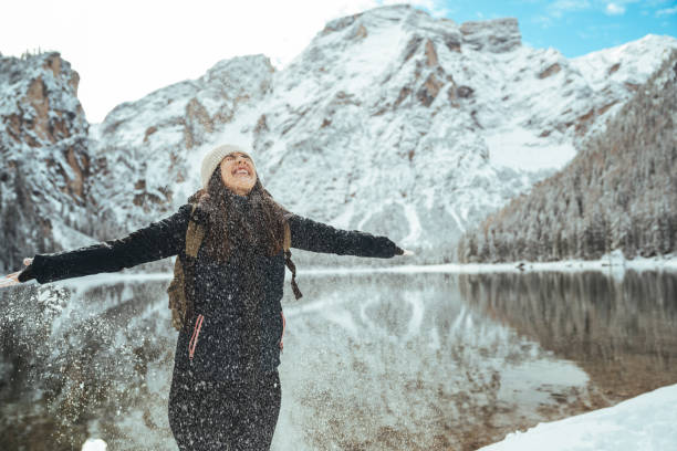 istock Young woman having fun and enjoy fresh snow 1461590921