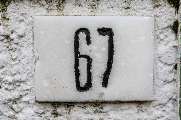 istock Closeup of the number 419 on the rustic white wall 1461590966