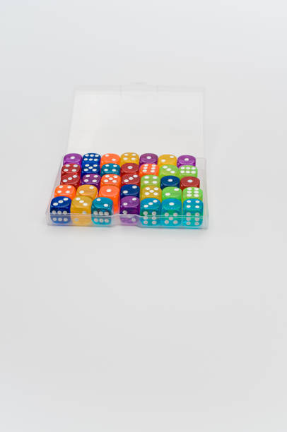 istock box of multicolored dice on a white background with text space 1461591767