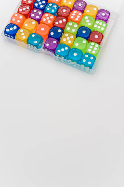 istock box of multicolored dice on a white background with text space 1461591781