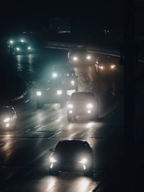 istock Vehicles drive on highway at night 1461592178