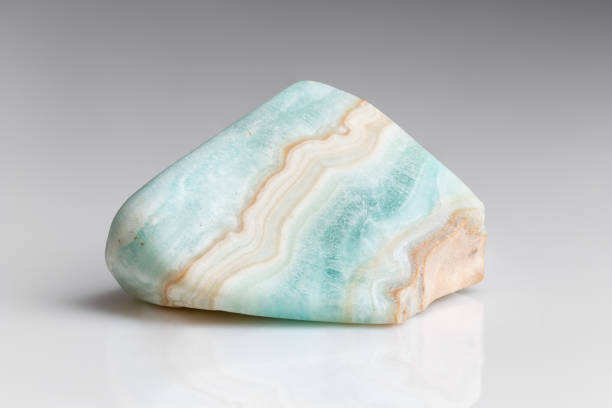 istock Polished Blue Aragonite Mineral Gem Stone on Grey 1461593100