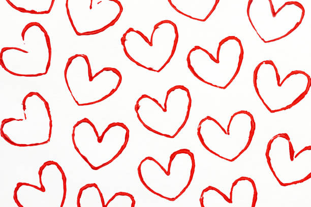 Handmade Valentine's Day card with red printed hearts on white background.