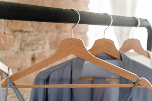 istock Wooden hangers with different outfits in the wardrobe 1461593251