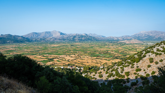 Panoramic view of Lasithi Plateau from Cave of Diktaion Andron. Amazing aerial view of famous Lasithi Plateau in Crete, Greece