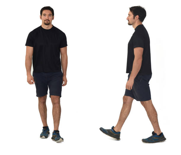 istock front and side view of a man with sportswear walking on white background 1461596635