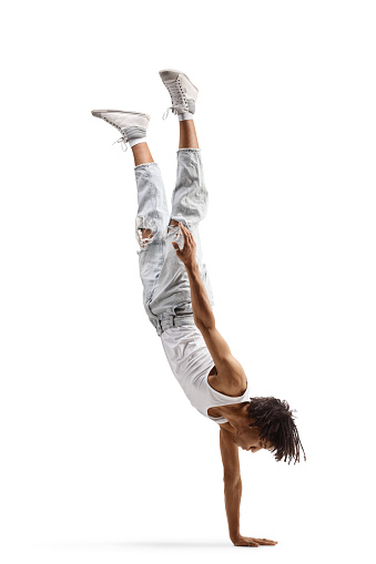 African american male dancer performing a handstand isolated on white background