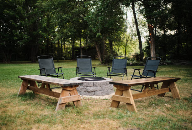 istock Cam with benches and chairs in the forest 1461598364