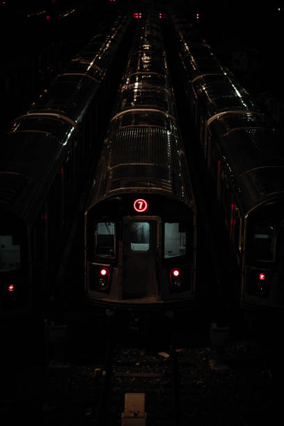 istock Vertical shot of silver trains at a dark station 1461598395