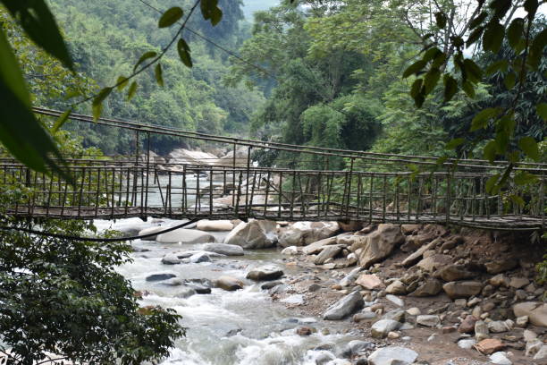 istock Antique Rope Bridge over Rocky Stream in Sa Pa 1461599550