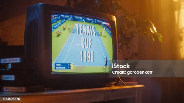 Close Up Footage Of A Dated Tv Set Screen With Live Sports Tennis Match Broadcast Two Athletic Female Players In Staged World Cup 1998 Nostalgic Retro Nineties Technology Concept Stock Photo - Download Image Now
